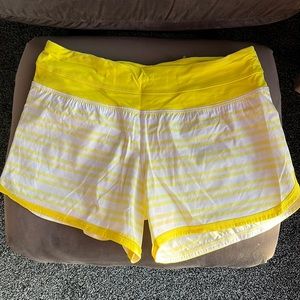 Lululemon women’s shorts size 6. Never worn. Yellow and white